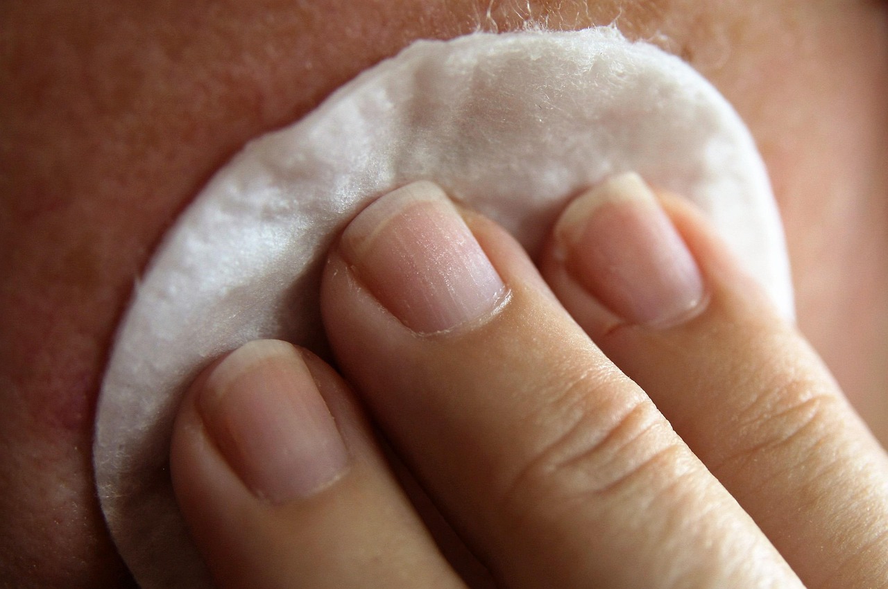 A cotton pad pressed gently against skin